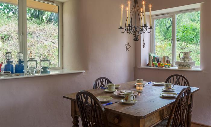 Dining table with candelabra. Booster seat for babies and toddlers.
